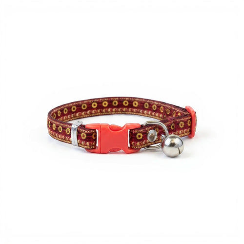 Tap2Own red fabric cat collar with gold and black pattern trim, adjustable strap, quick-release buckle, and silver bell.