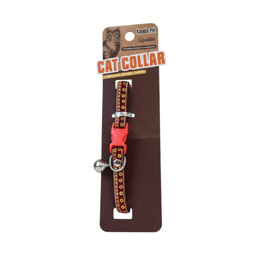 Tap2Own red fabric cat collar with gold and black pattern trim, adjustable strap, quick-release buckle, and bell.