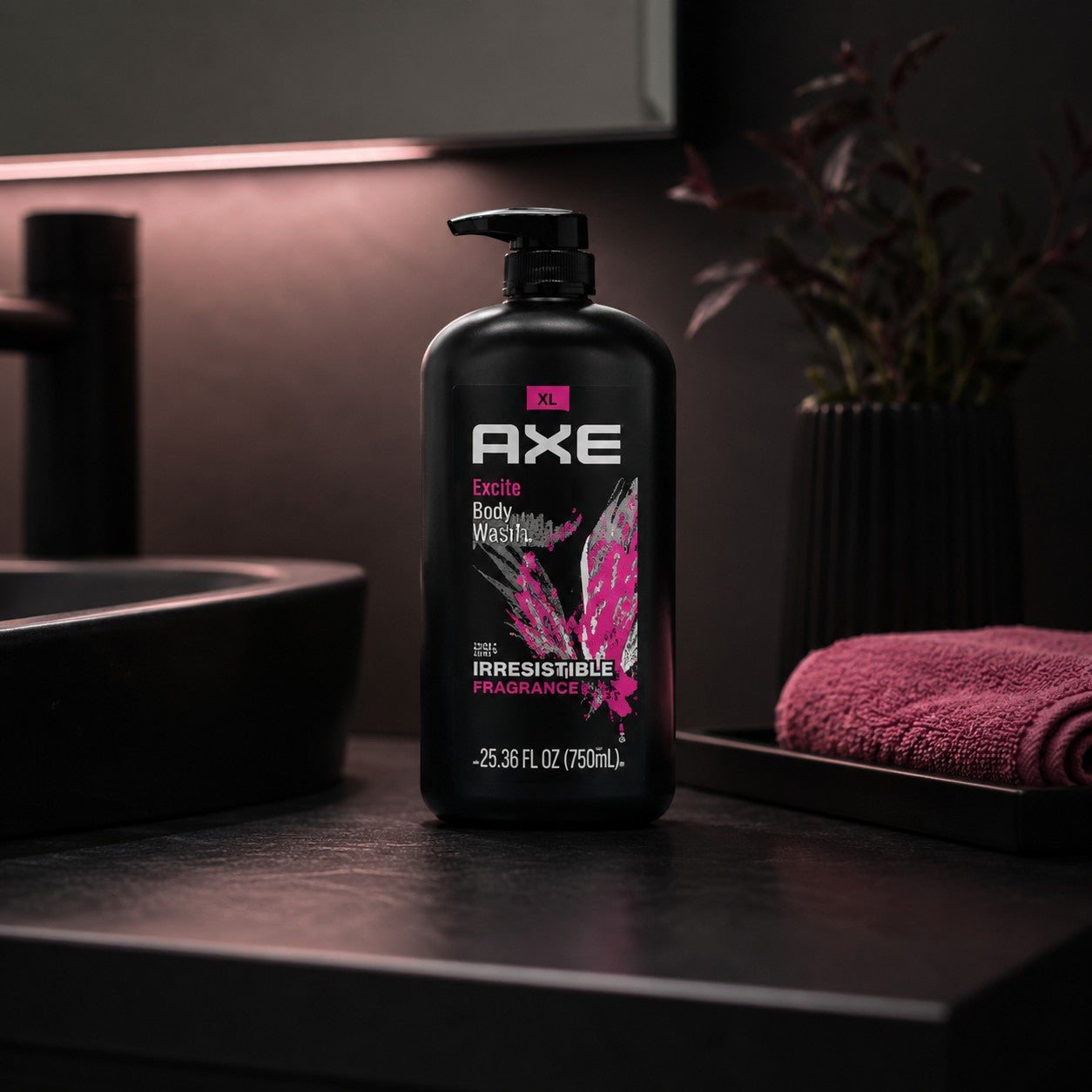 Tap2Own AXE Excite 3-in-1 body, face, and hair wash in a large black pump bottle on a dark bathroom counter.
