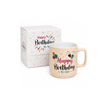 Tap2Own peach ceramic mug with "Happy Birthday To You" text, balloons, and confetti. Includes matching gift box.