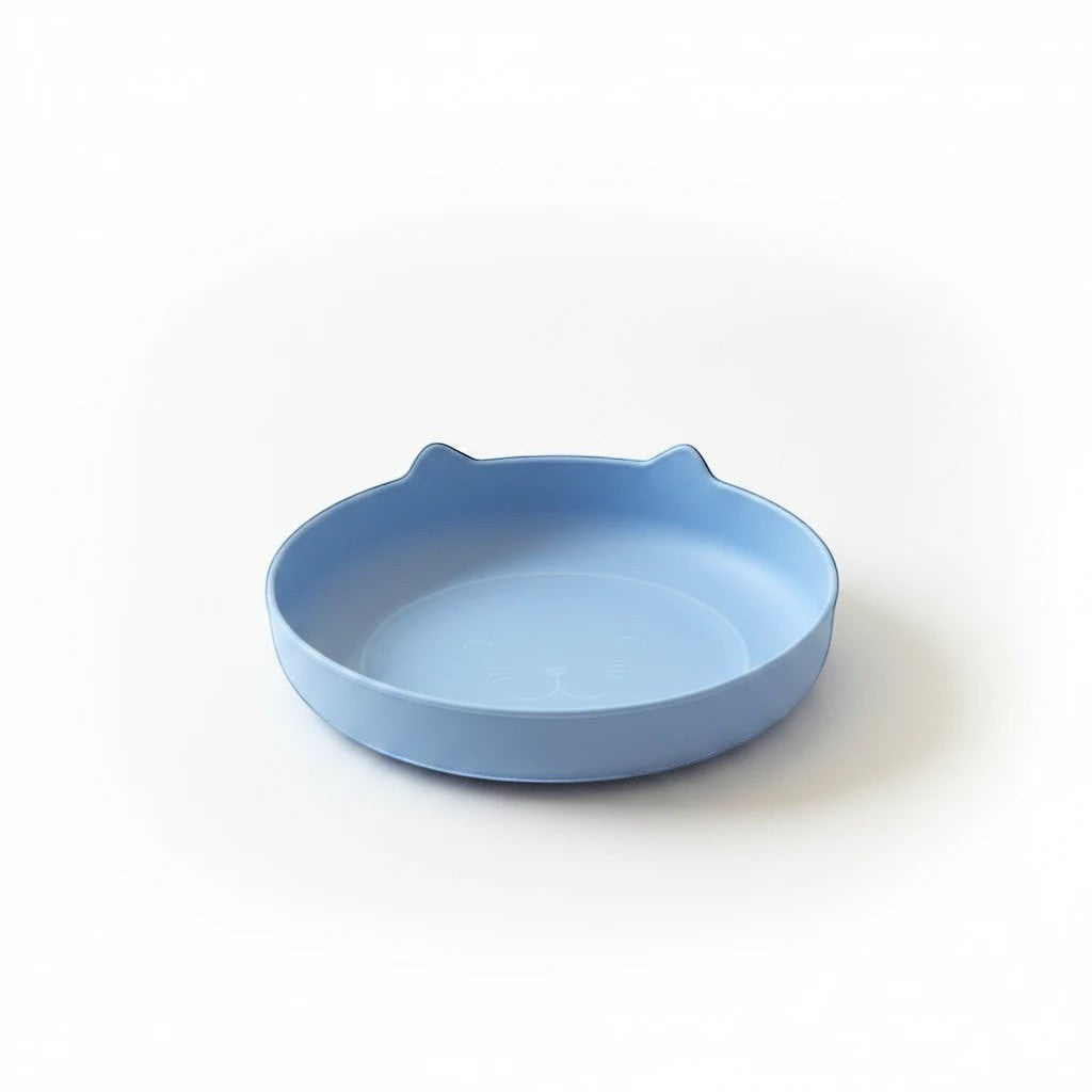 Tap2Own blue cat-shaped pet food and water bowl with etched face and ears. Shallow, wide design reduces whisker fatigue.