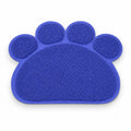 Tap2Own blue paw-shaped pet feeding mat for food and water bowls, made of waterproof material.