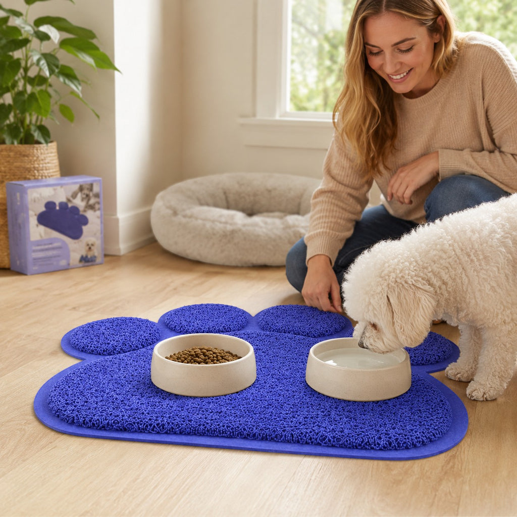 Tap2Own blue paw-shaped pet feeding mat with textured surface for food and water bowls, keeping floors clean.