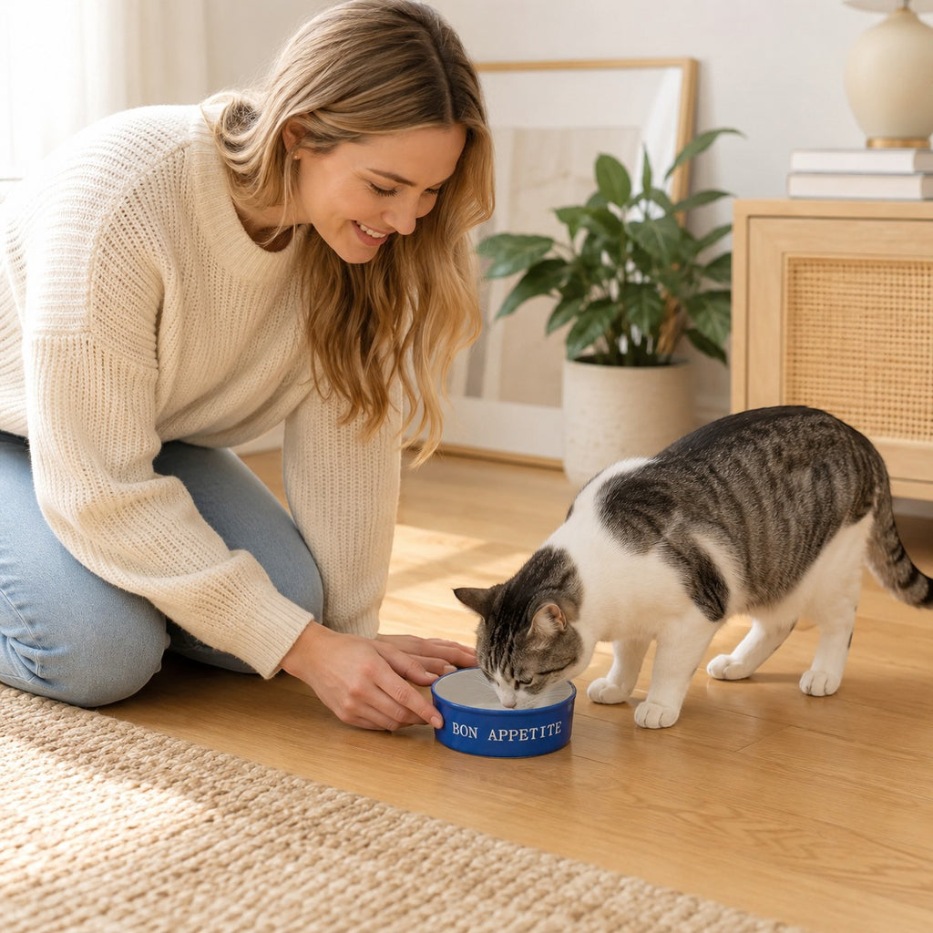 Tap2Own blue ceramic cat bowl with "Bon Appetit" text and cat face graphic, perfect for food or water.