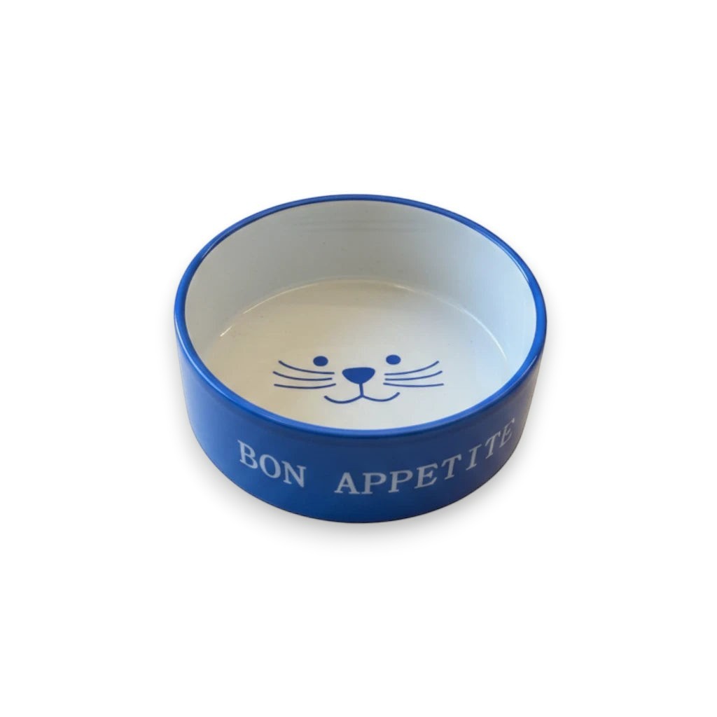 Tap2Own blue ceramic cat food and water bowl with "Bon Appetit" text and cat face graphic.