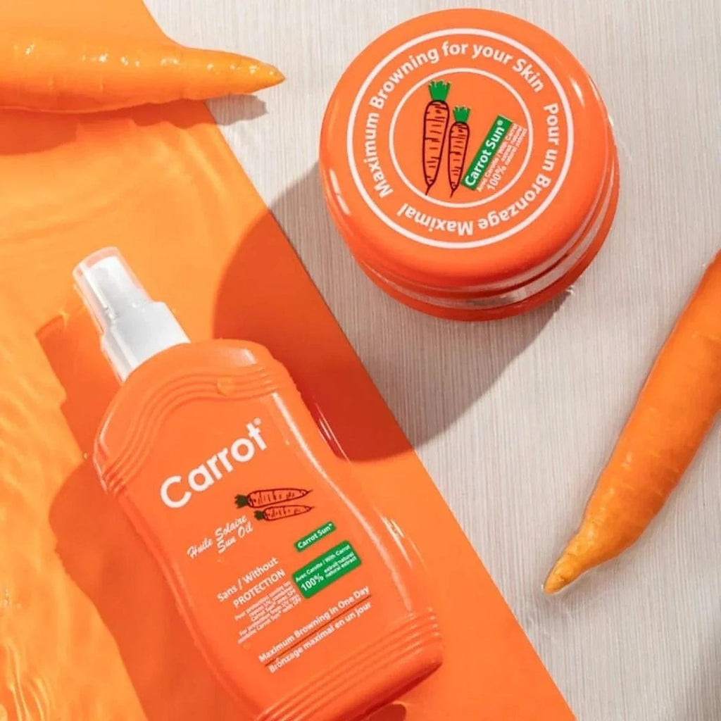 Tap2Own Carrot Sun natural tanning cream jar and spray oil bottle with fresh carrots on an orange background