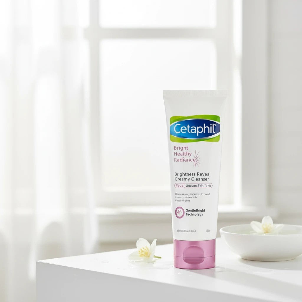 Tap2Own Cetaphil Bright Healthy Radiance creamy face cleanser in a white tube with a pink cap on a bright surface.