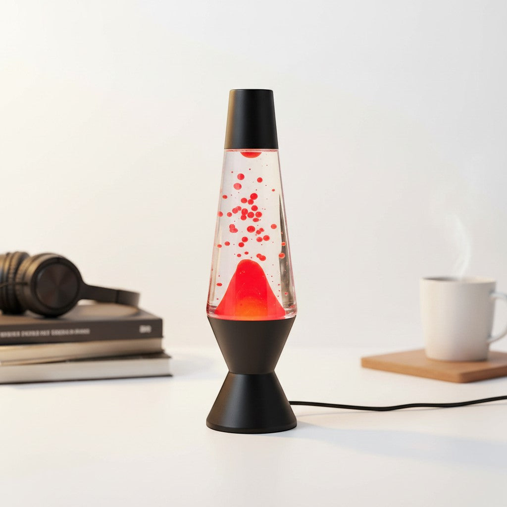 Tap2Own classic lava lamp with red blobs rising in clear liquid, black base and cap. Ambient light.