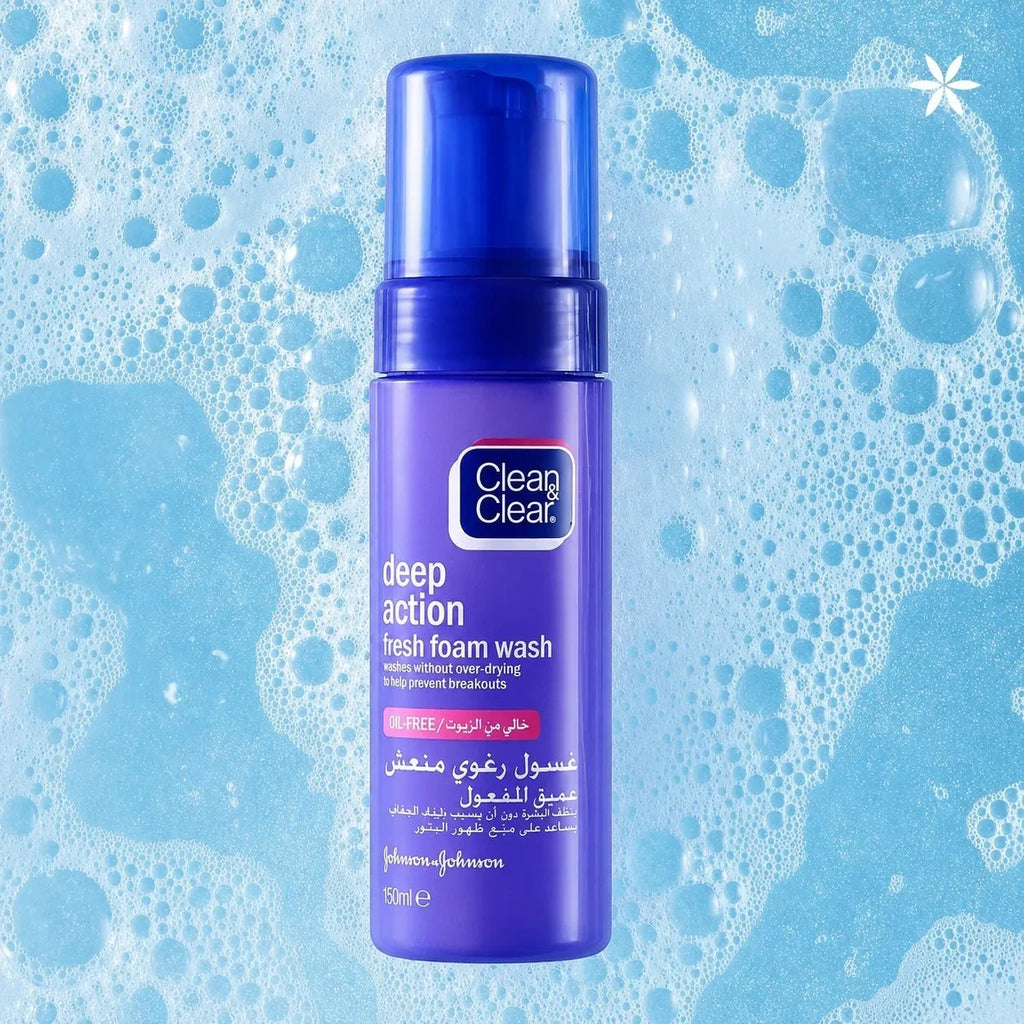 Tap2Own Clean & Clear Deep Action Fresh Foam facial cleanser in a purple bottle surrounded by refreshing soap bubbles.