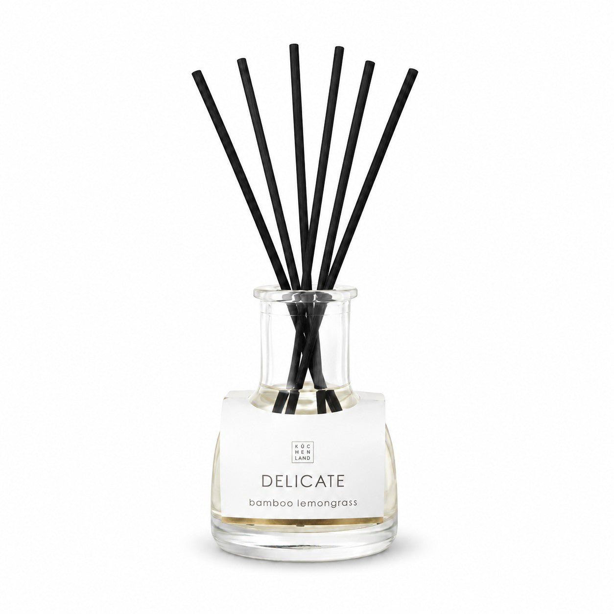 Tap2Own Delicate Bamboo Lemongrass perfume diffuser with black reeds in a clear glass bottle.