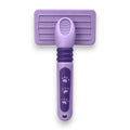 Tap2Own lavender deshedding brush for dogs and cats with paw print details and ergonomic handle.