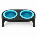 Tap2Own Elevated Double Pet Bowl Set with two bright blue silicone bowls on a black stand.