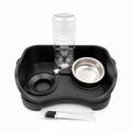 Tap2Own black elevated pet feeding station with automatic water dispenser and stainless steel bowls. Includes cleaning brushes.