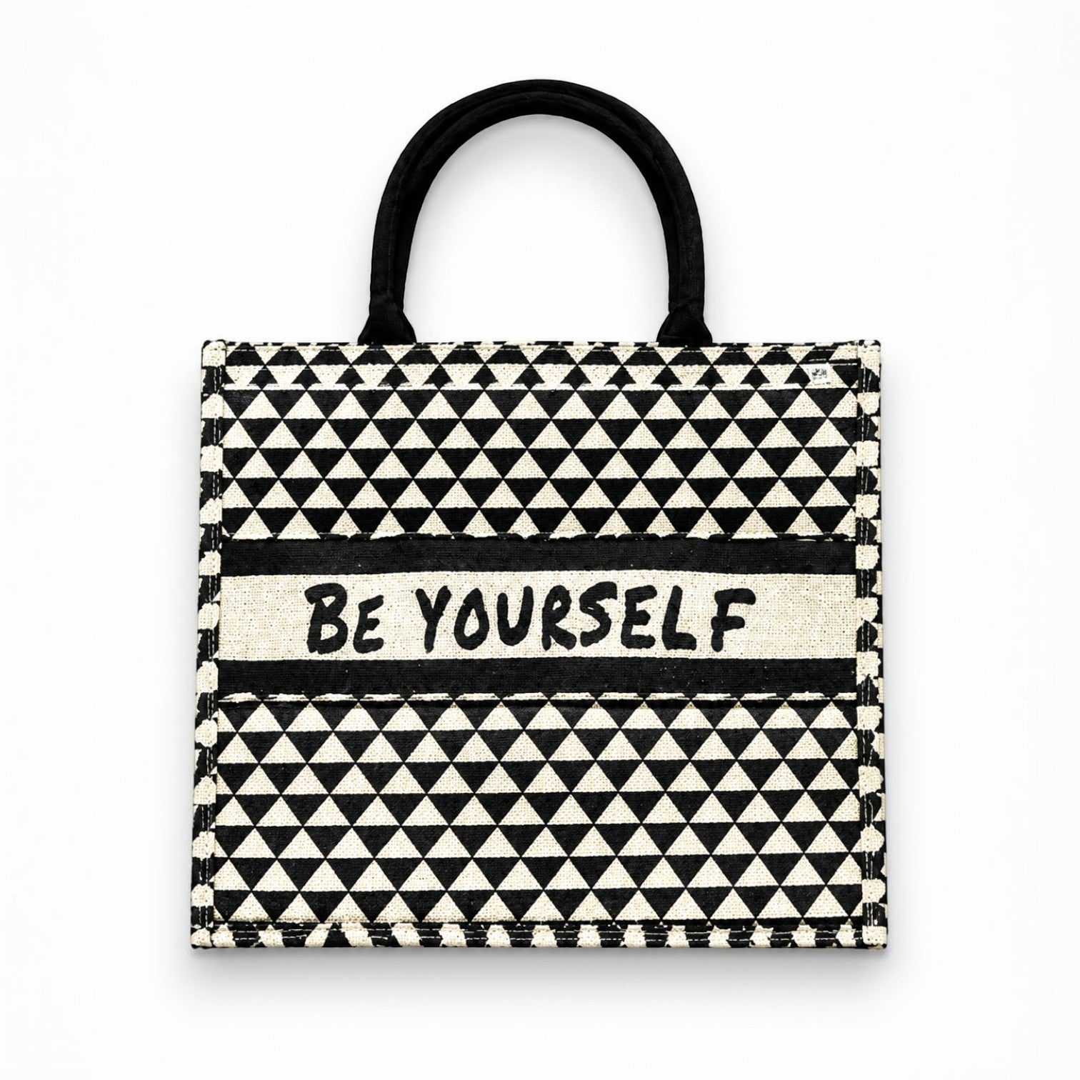 Tap2Own Be Yourself graphic tote bag in black and white geometric pattern with sturdy black handles.