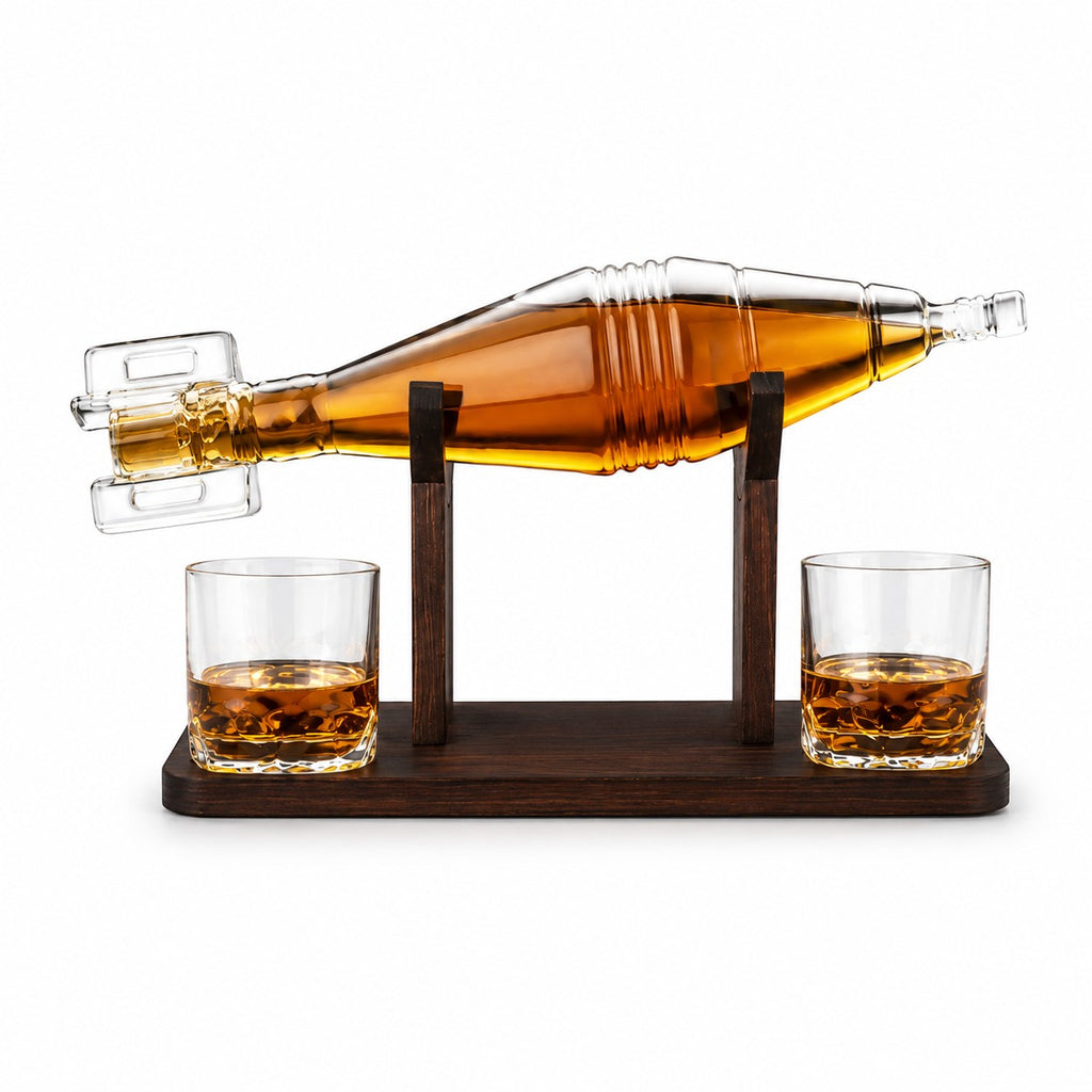 Tap2Own grenade-shaped glass whiskey decanter with two glasses and wooden stand, filled with amber liquid.