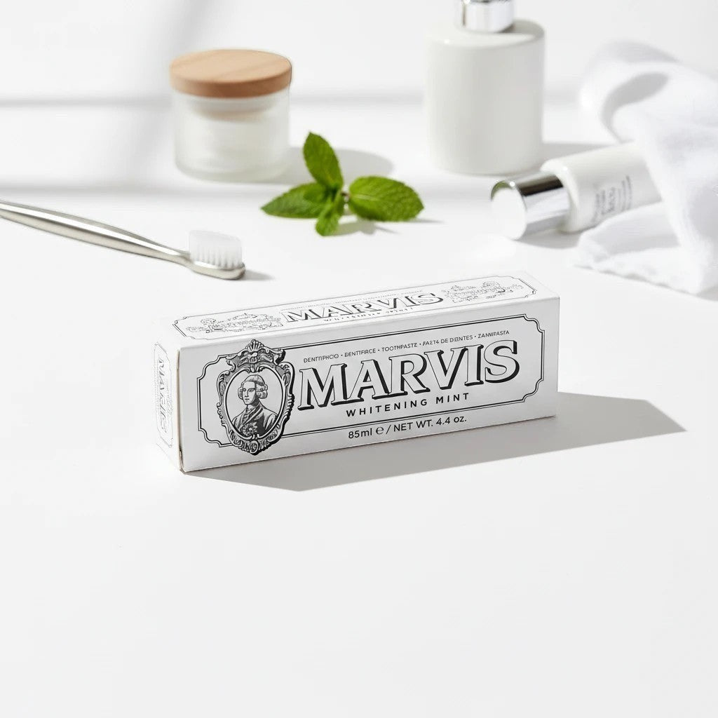 Tap2Own Marvis Whitening Mint toothpaste in vintage-style white packaging on a bright bathroom vanity.