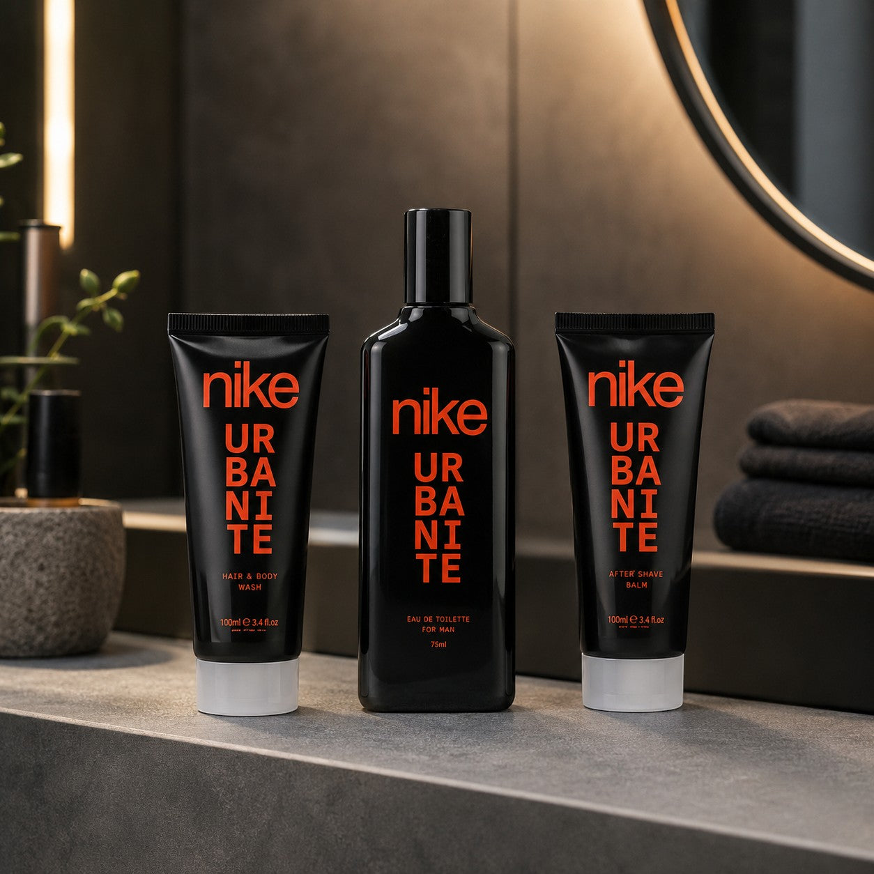 Tap2Own Nike Urbanite Woody Lane grooming set featuring black bottles with red text on a modern bathroom vanity.