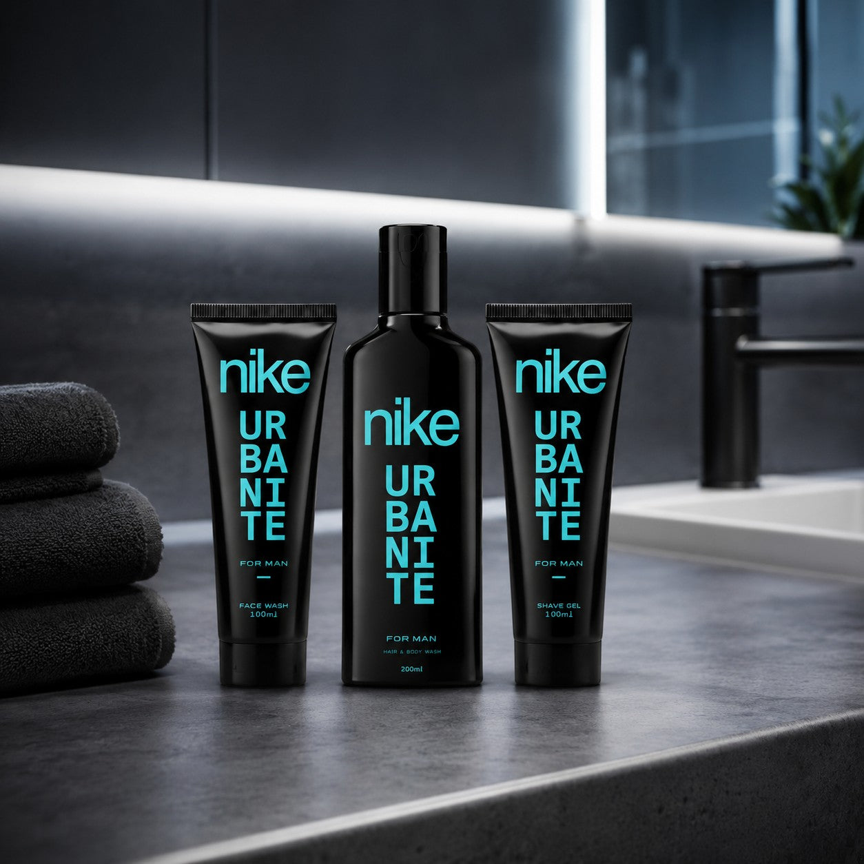 Tap2Own Nike Urbanite men's grooming set featuring black bottles with cyan text on a modern bathroom counter
