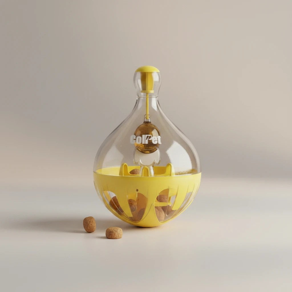 Tap2Own ColPet yellow and clear interactive treat dispensing pet toy with treats inside and outside.