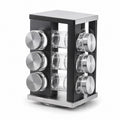 Tap2Own black rotating spice rack organizer with 12 clear glass jars and stainless steel lids. Modern kitchen counter storage.