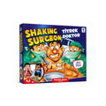 Tap2Own Shaking Surgeon Family Game box art featuring cartoon surgeons operating on a patient whose nose lights up if players shake. Includes two children playing.