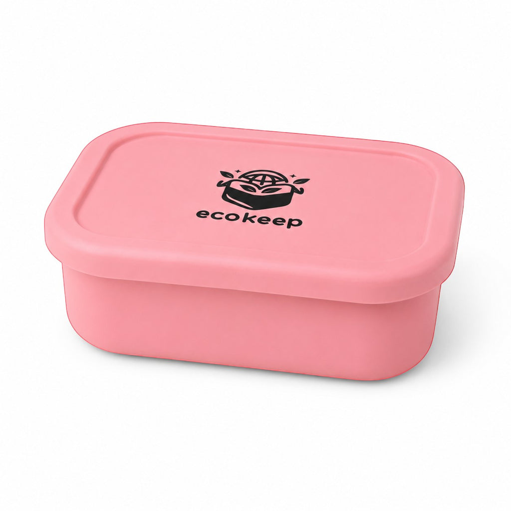 Tap2Own pink silicone bento lunch box with multiple compartments and secure lid. Food-grade silicone.