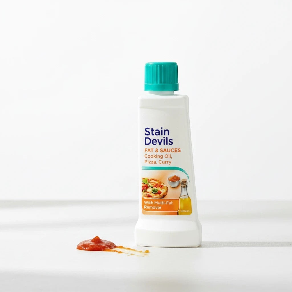 Tap2Own Stain Devils Fat and Sauces laundry stain remover bottle with a teal cap on a white surface