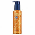 Tap2Own Vaseline Illuminate Me shimmering golden body oil in a clear pump bottle for a radiant, dewy skin glow.