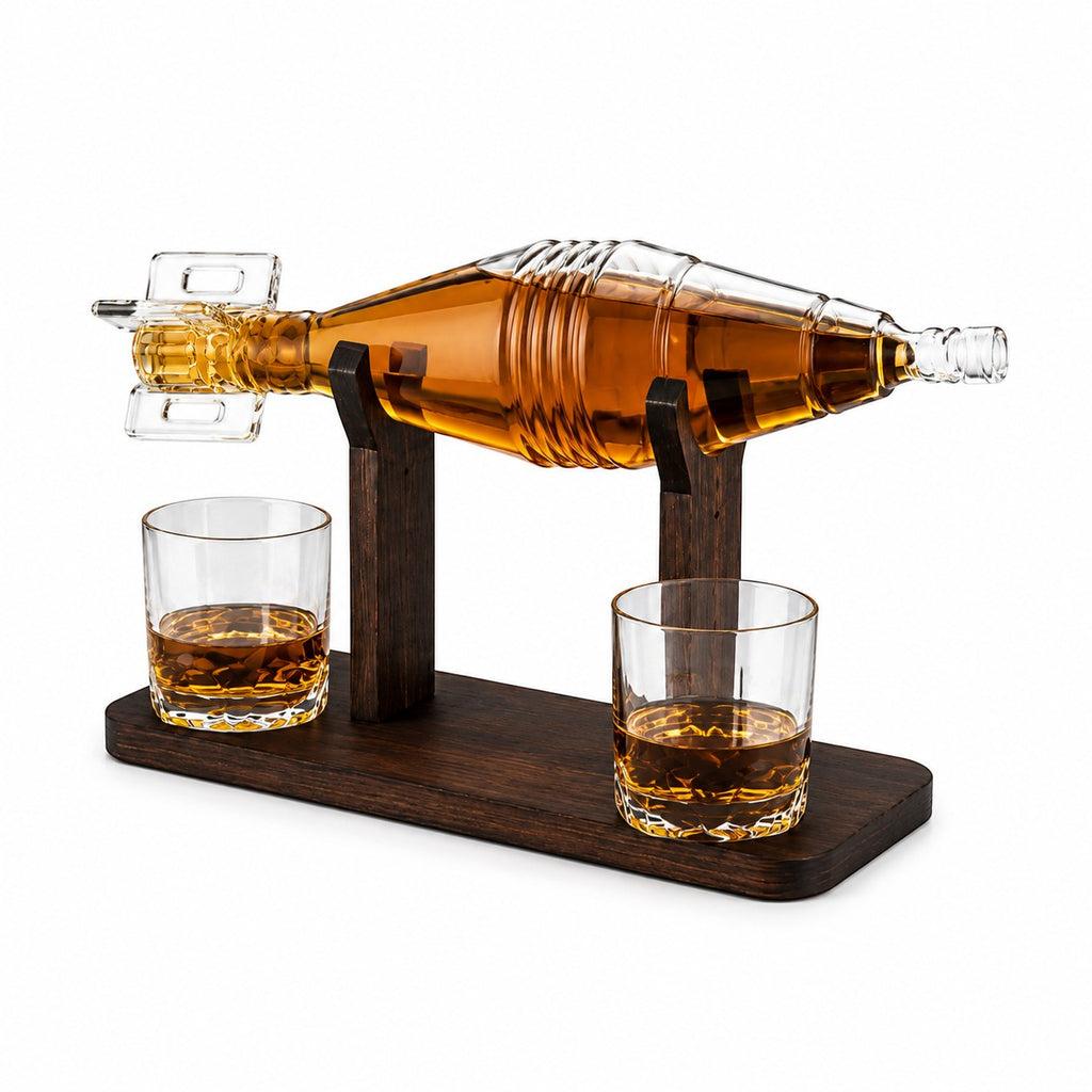 Tap2Own unique whiskey decanter gift set with two glasses and wooden stand. Glass decanter shaped like a bomb, filled with amber liquid.